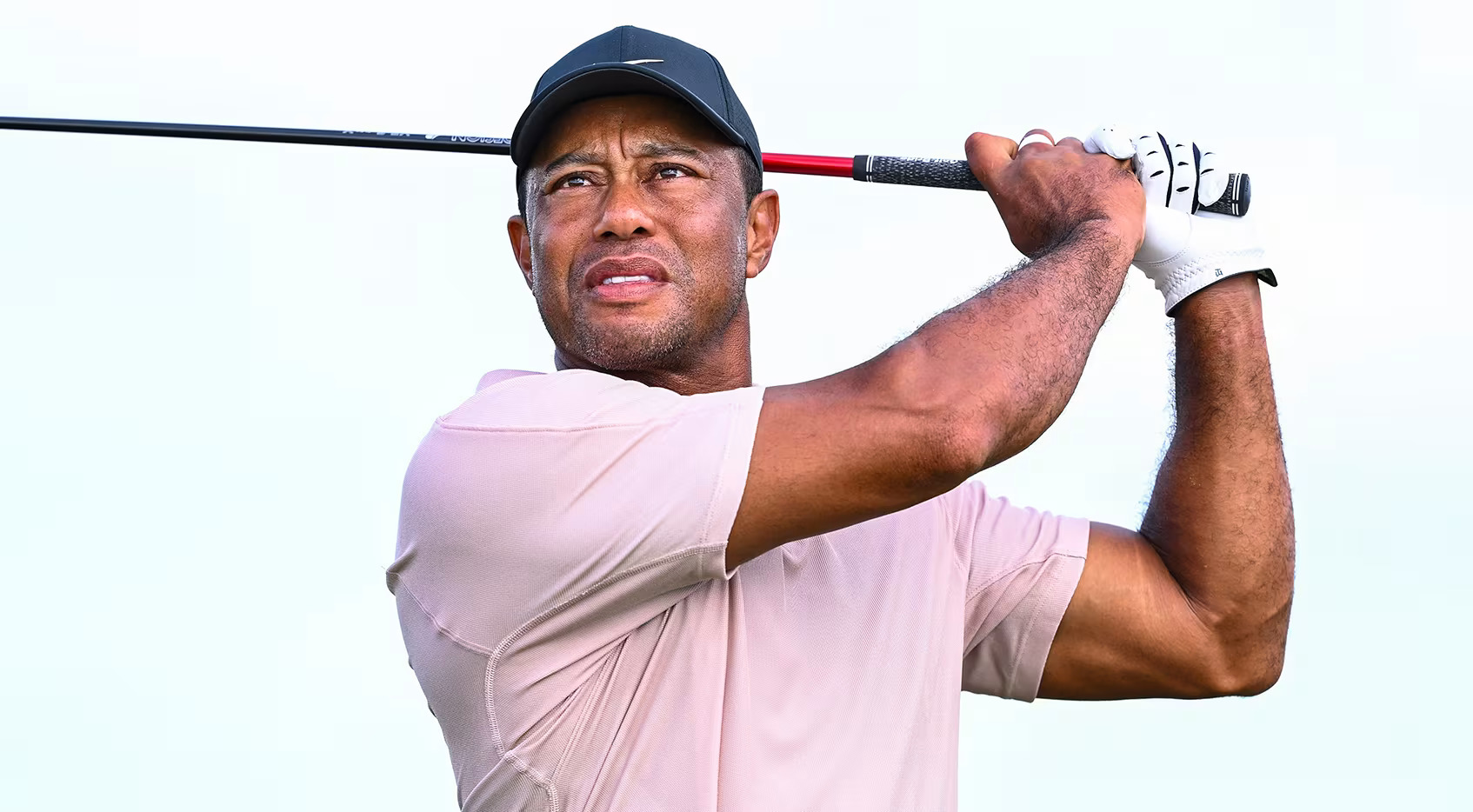 Tiger Woods in a thoughtful pose, reflecting on his future in golf